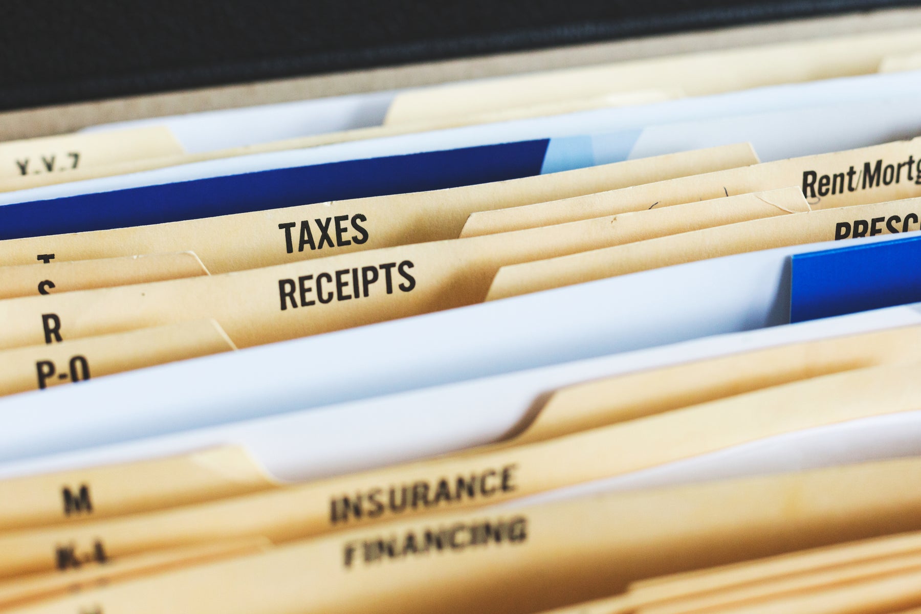 Tax documents and financial statements being reviewed at Oldest City Financial Consulting in St. Augustine, Florida